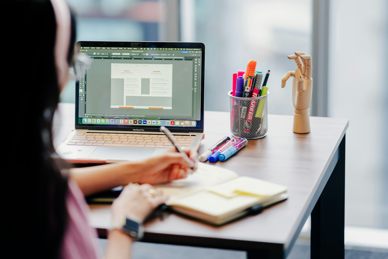 Designer planning improvements at a laptop